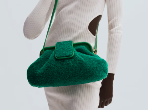 A large green handbag with snap closure from Maison Orient.