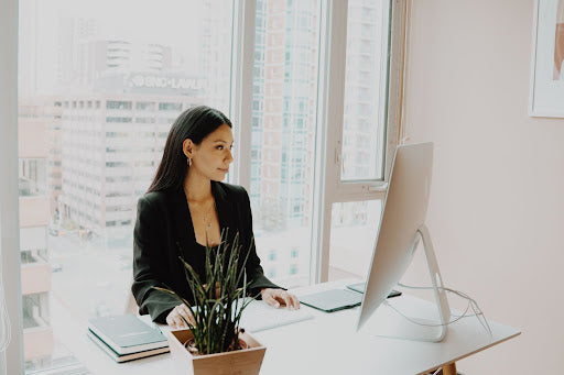 Woman sitting at a desk.