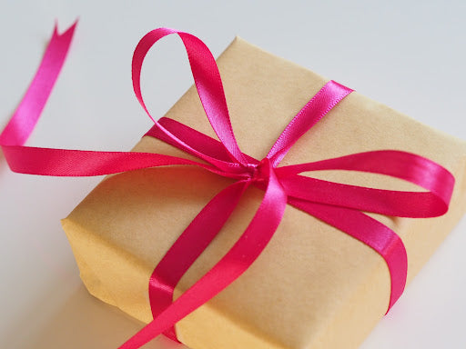 Gift box with pink bow.