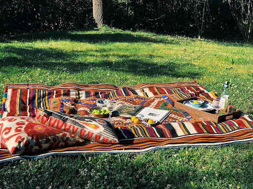 Picnic on the grass using the Kilim Tablecloth.
