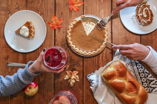 Woman cutting pumpkin pie