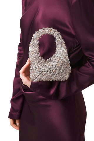 Multicolour beaded Jodie mini bag carried by hand