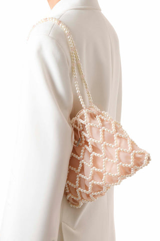 Ivory and light peach Belle beaded shoulder bag worn on the shoulder